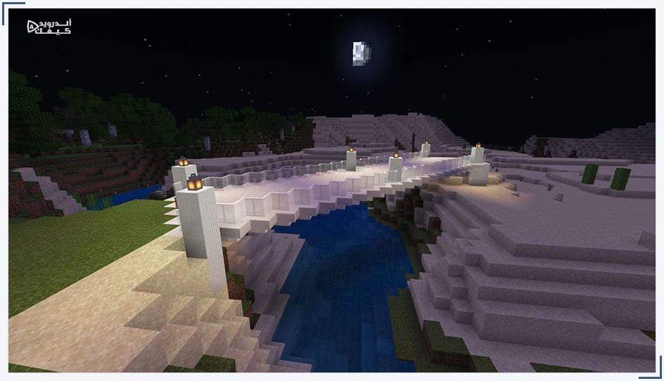 جسر كوارتز في Minecraft يمتد فوق نهر وتضيئه مصابيح ليلية